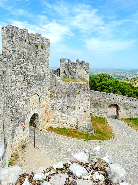 Berat Castle stone walls and towers with scenic hillside view in Albania.