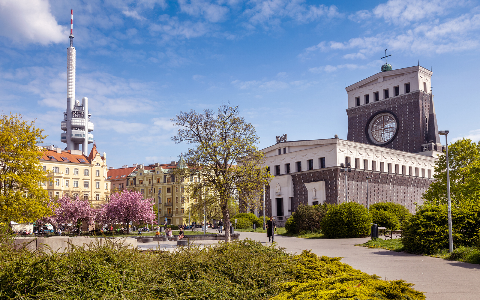 Prague hop-on hop-off bus tour passing by historic city landmarks with optional boat tour.
