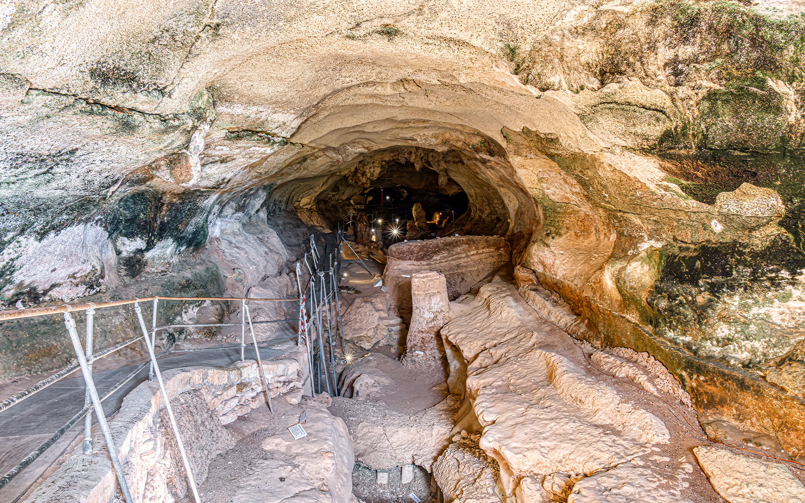 Ghar Dalam caves entrance with stone pathway in Malta.