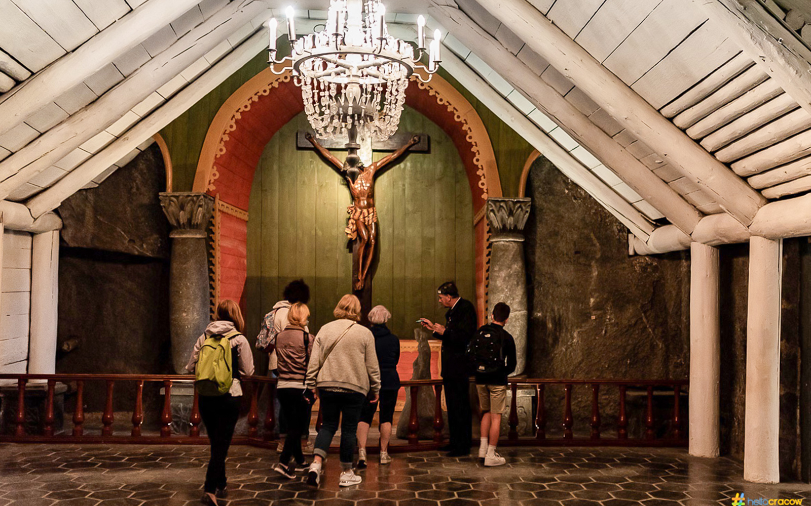 Guests touring Wieliczka Salt Mine chapel with guide.