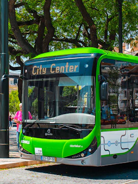 Aerobus in Lisbon city center with green and white design.
