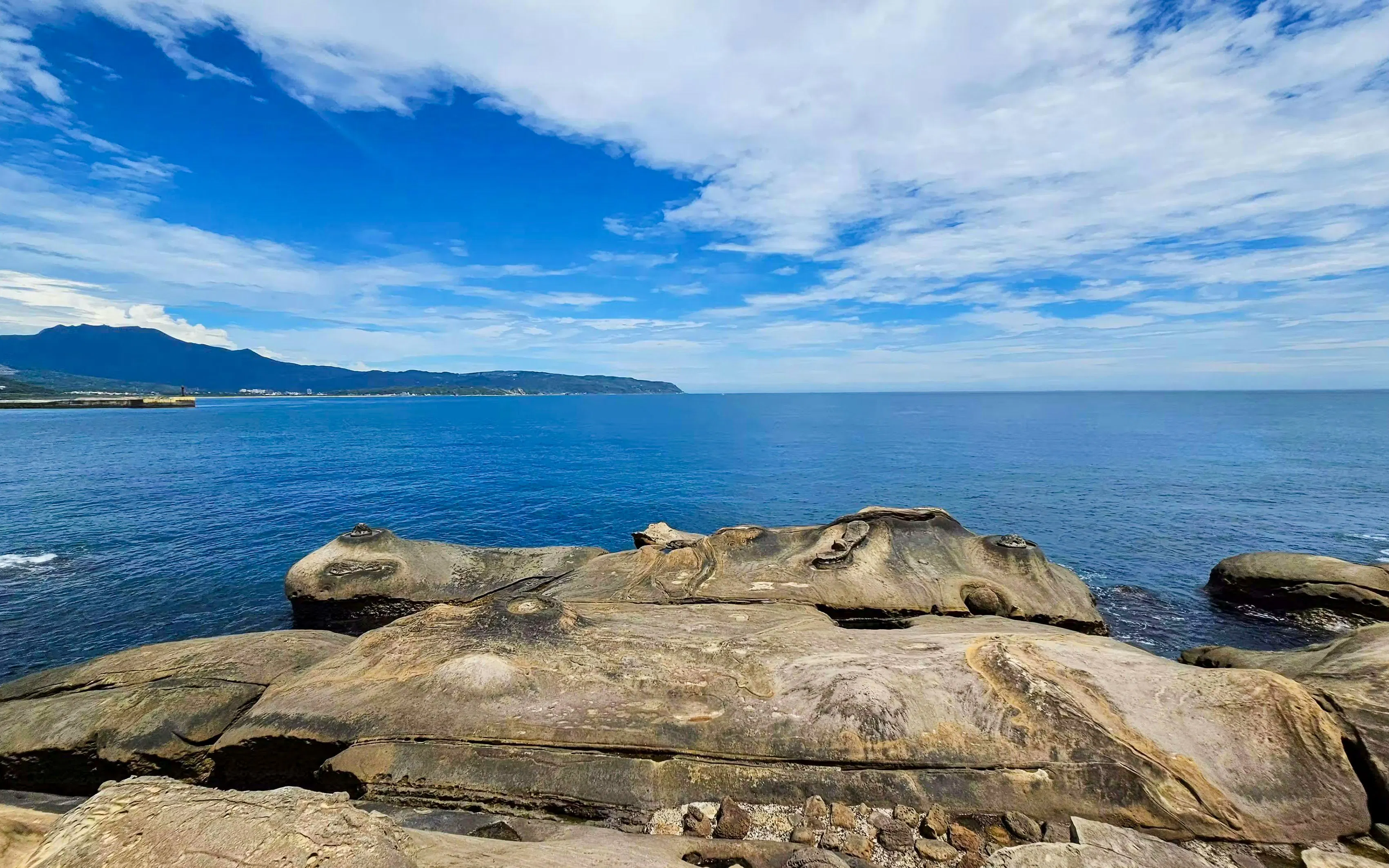 Fairy's Shoe rock formation at Yehliu Geopark, New Taipei City, overlooking the ocean.
