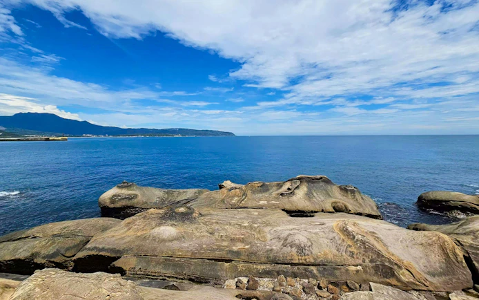 Fairy's Shoe rock formation at Yehliu Geopark, New Taipei City, overlooking the ocean.