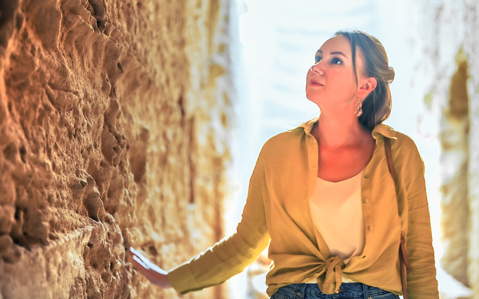 woman observing archaeological site