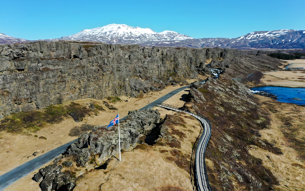 Aerial view of Thingvellir National Park with Icelandic flag, part of the Golden Circle near Reykjavik.