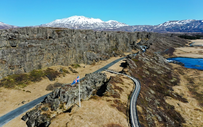 Aerial view of Thingvellir National Park with Icelandic flag, part of the Golden Circle near Reykjavik.