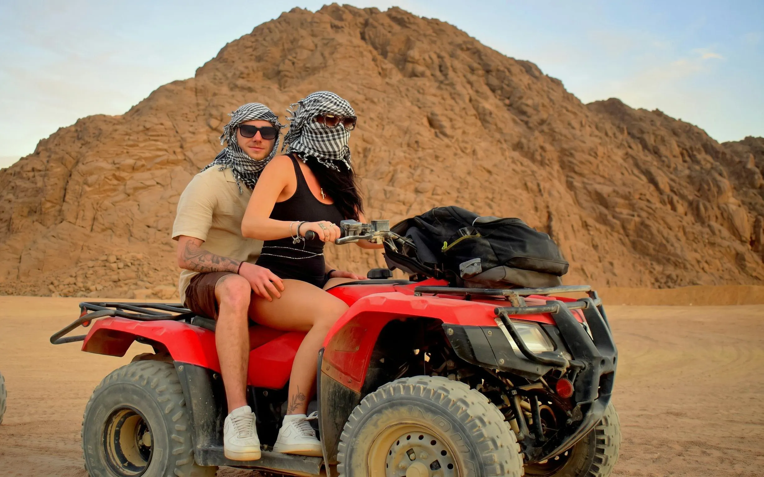 Couple riding a quad bike in the Sinai Desert, Sharm El Sheikh.
