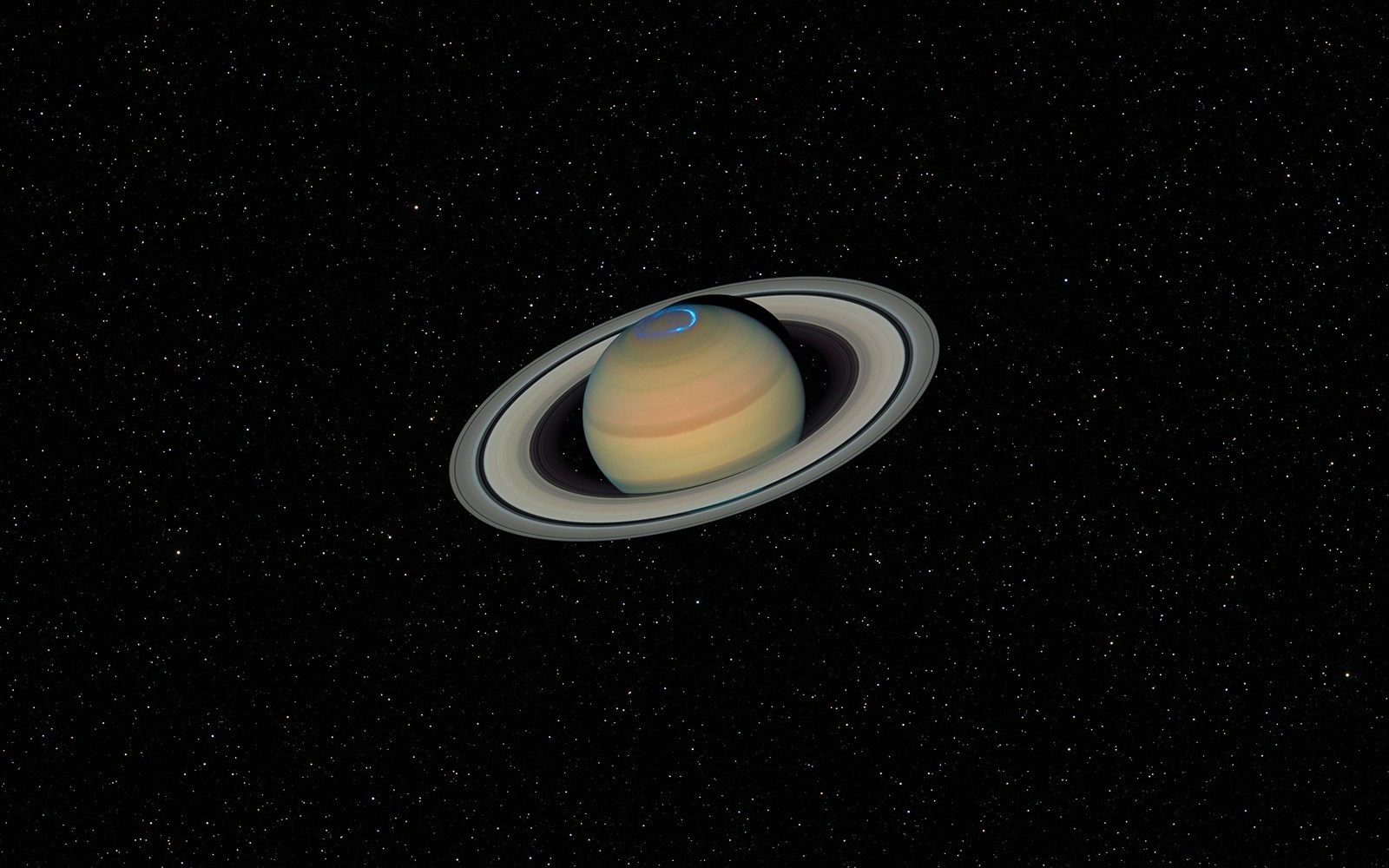 Saturn with rings against a dark starry sky in the Solar System.