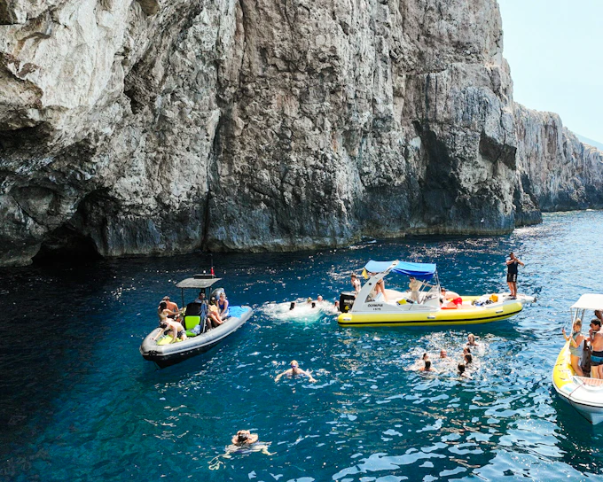 From Vlore: Unknown Escape Party Boat Cruise with Drinks, Music & Secret Swim Stops