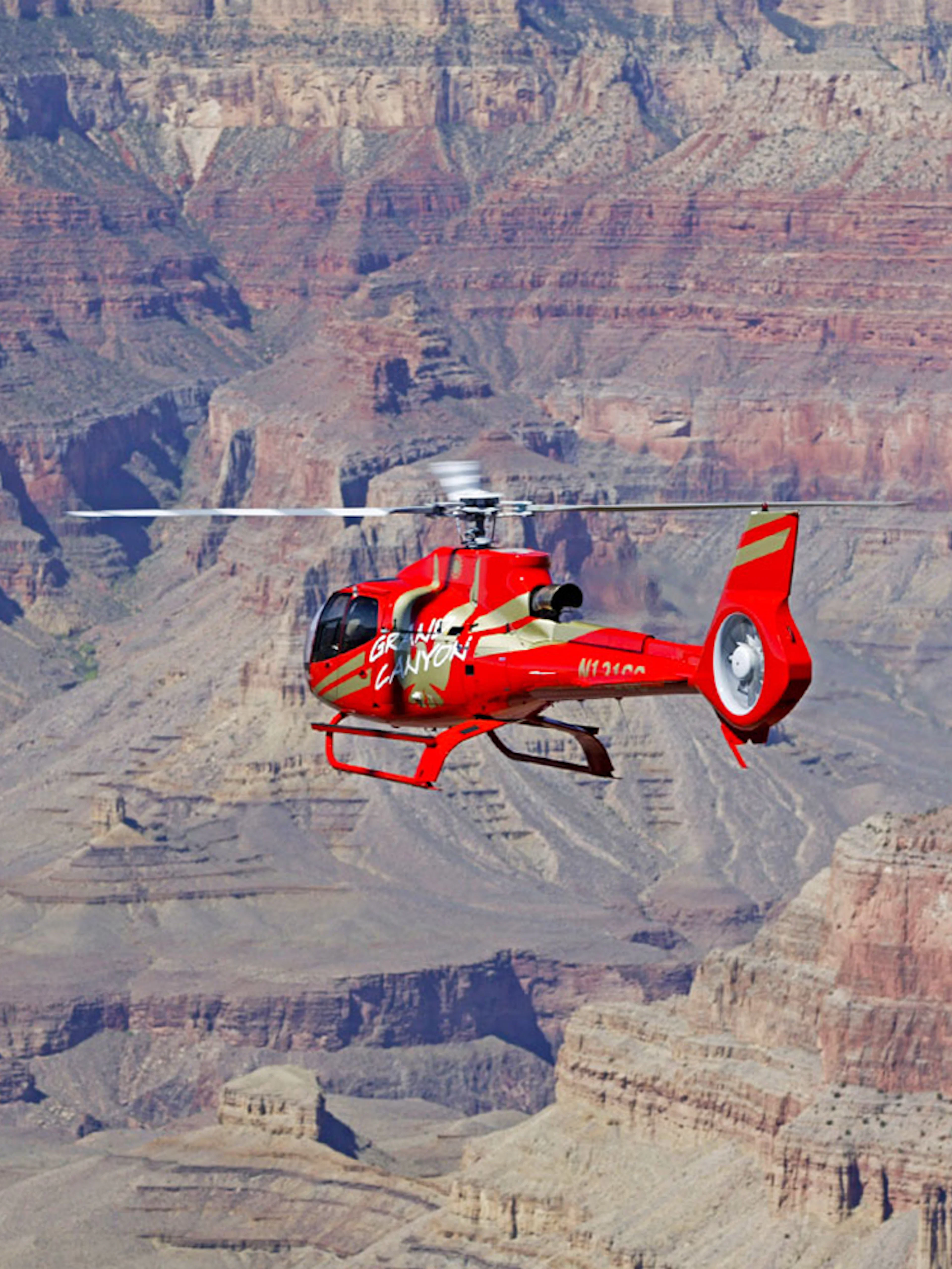 Helicopter flying over the Grand Canyon during the Grand Kingdom with Hummer Tour.
