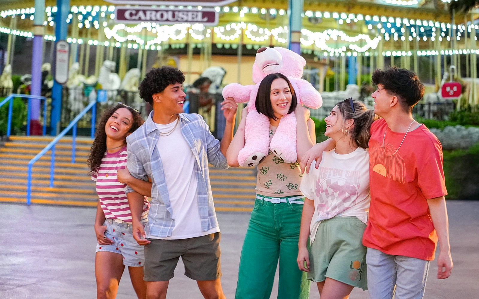 Friends enjoying the Grand American Carousel at Six Flags Magic Mountain.