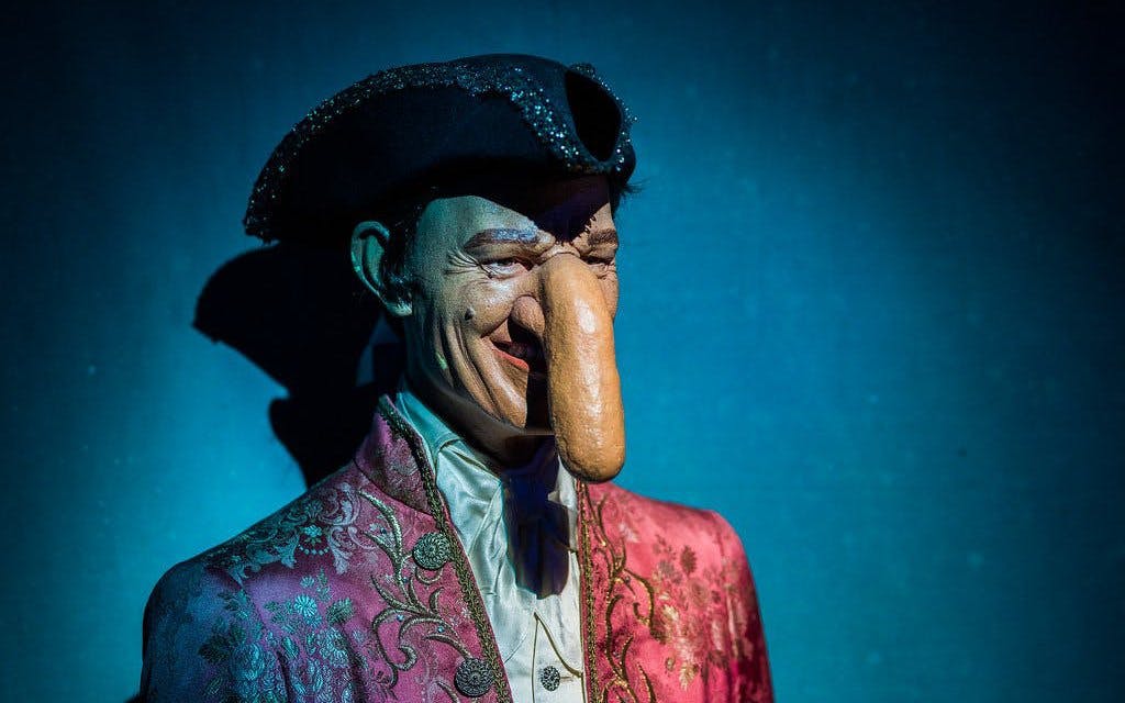 Mannequin with long nose in ornate costume at Ripley's Believe It or Not! exhibit.