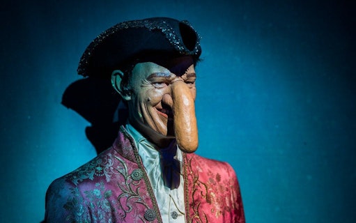 Mannequin with long nose in ornate costume at Ripley's Believe It or Not! exhibit.