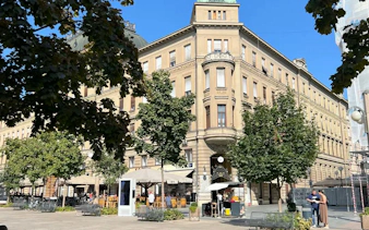 Historic building with outdoor cafes in Zagreb city center, part of the Zagreb Essentials Slavic Myths tour.