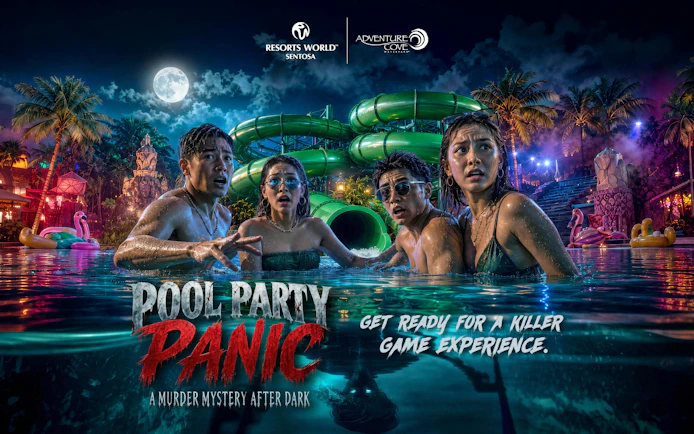 Guests in a pool at night with water slides and palm trees, Resorts World Sentosa.