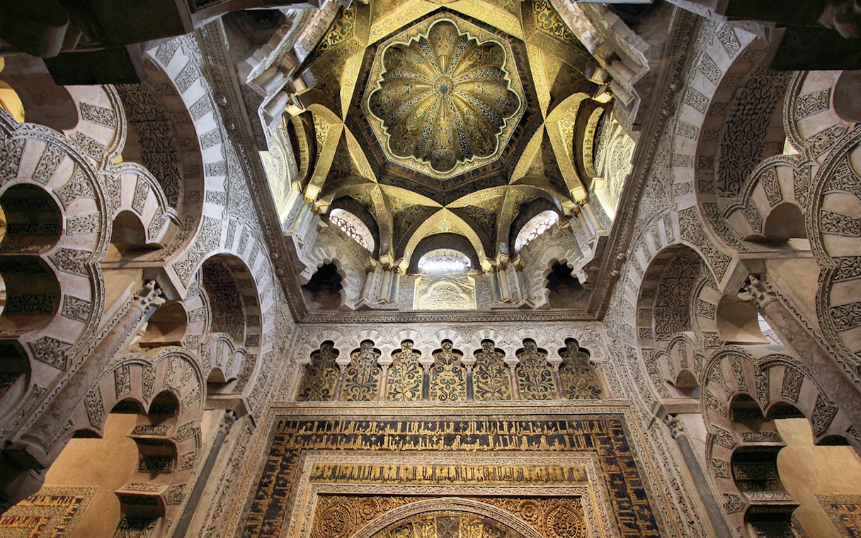 Cordoba Mosque-Cathedral Mihrab ceiling with intricate arches and detailed carvings.