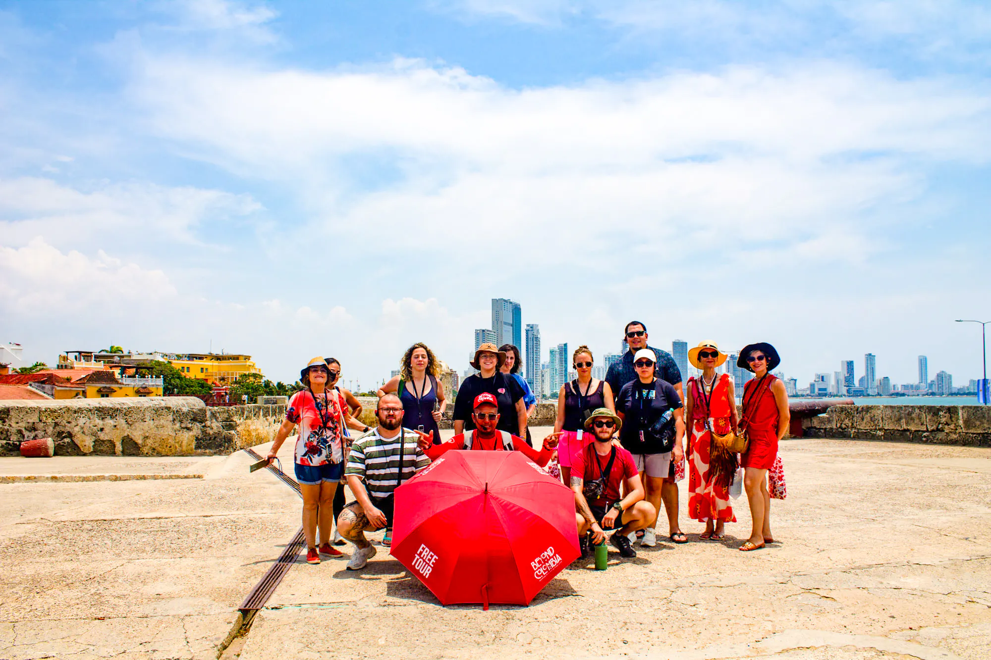 Tour group in Cartagena's Walled Old City with skyline in background.