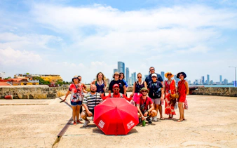Tour group in Cartagena's Walled Old City with skyline in background.