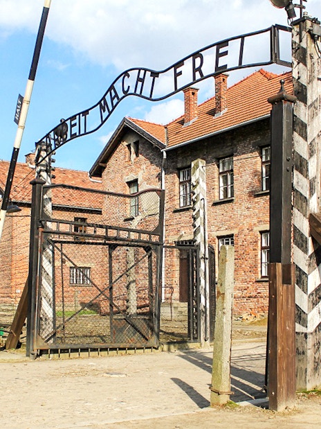 Entrance gate with "arbeit macht frei" at Auschwitz concentration camp, Poland.