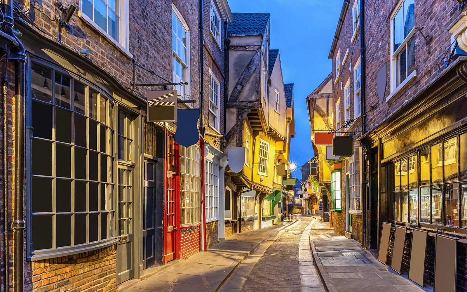 Narrow cobblestone street with historic buildings in The Shambles, York.