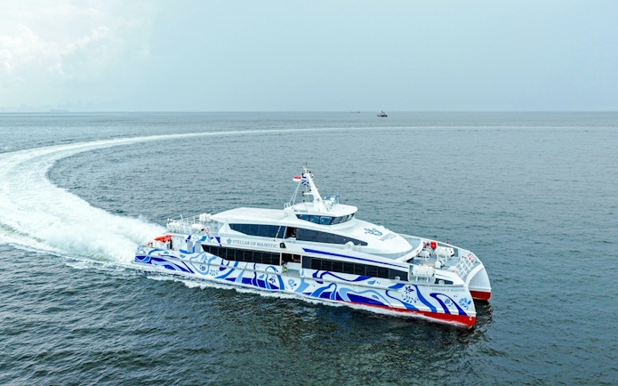 Ferry traveling from Singapore to Bintan across open sea.