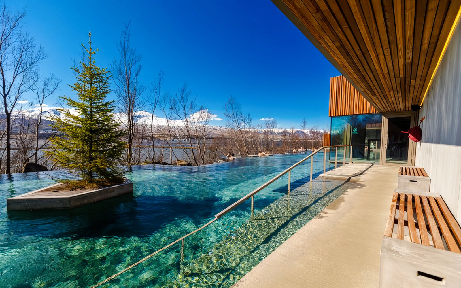 Entrance to Forest Lagoon geothermal spa with trees in Vaðlaskógur forest, near Akureyri, North Iceland.