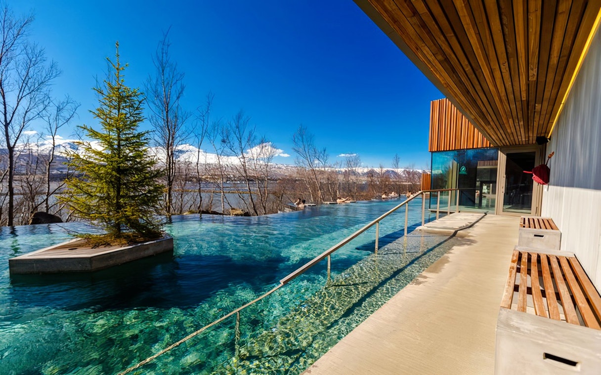 Entrance to Forest Lagoon geothermal spa with trees in Vaðlaskógur forest, near Akureyri, North Iceland.