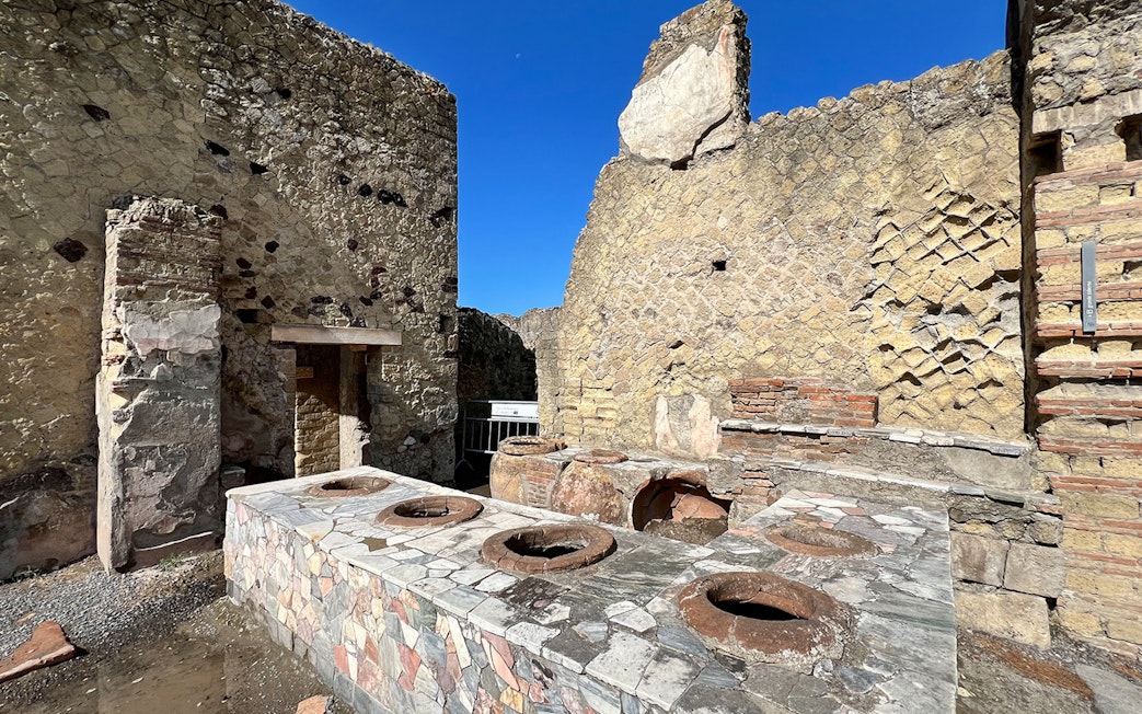 Ancient kitchen ruins with stone oven at Herculaneum, Italy.