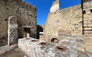Ancient kitchen ruins with stone oven at Herculaneum, Italy.
