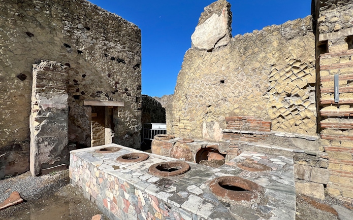 Ancient kitchen ruins with stone oven at Herculaneum, Italy.