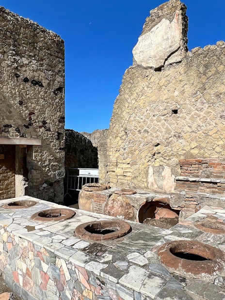 Ancient kitchen ruins with stone oven at Herculaneum, Italy.
