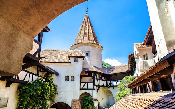 Bran Castle courtyard with medieval architecture in Transylvania.