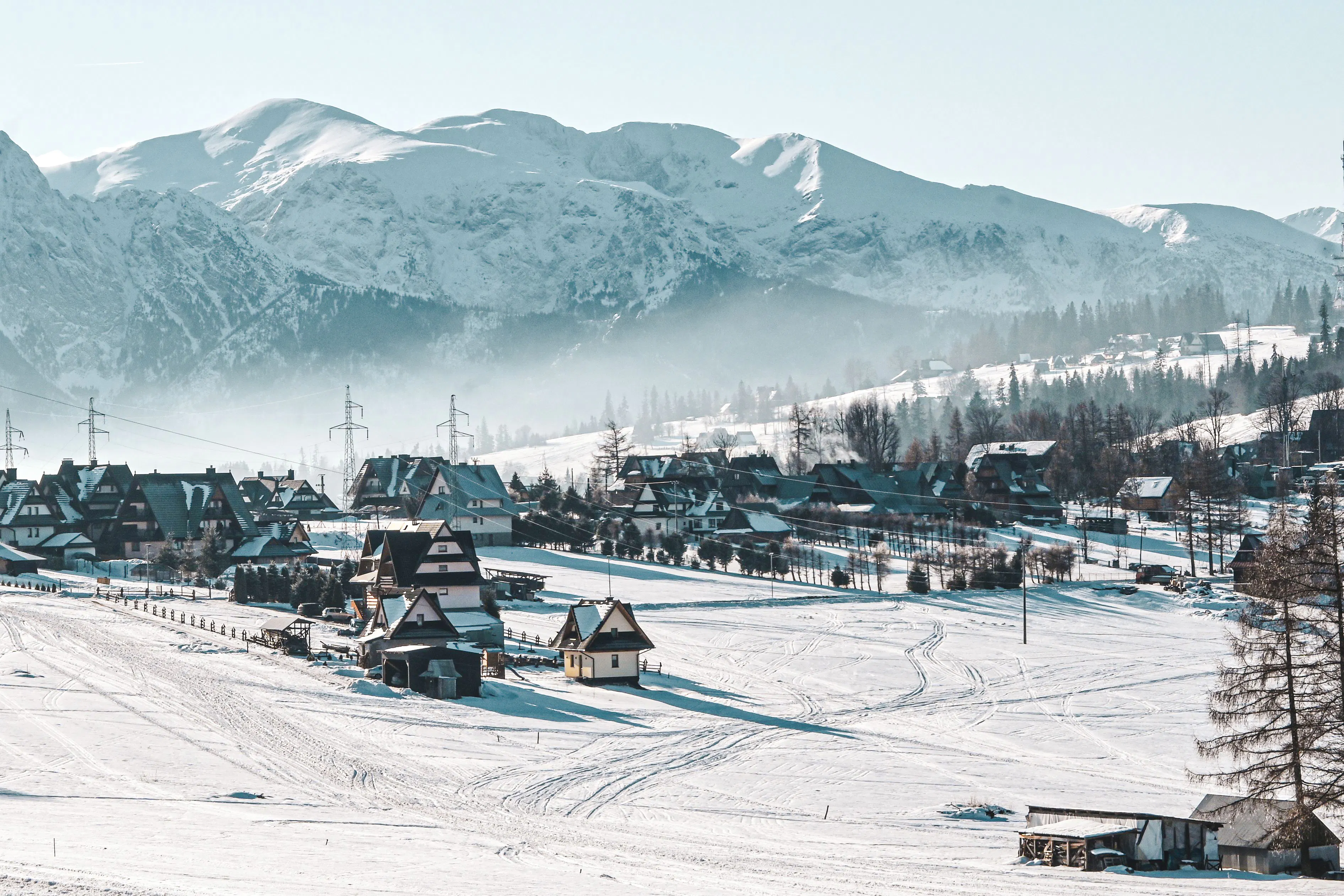 Snow-covered Zakopane village with Tatra Mountains backdrop on Krakow day trip.
