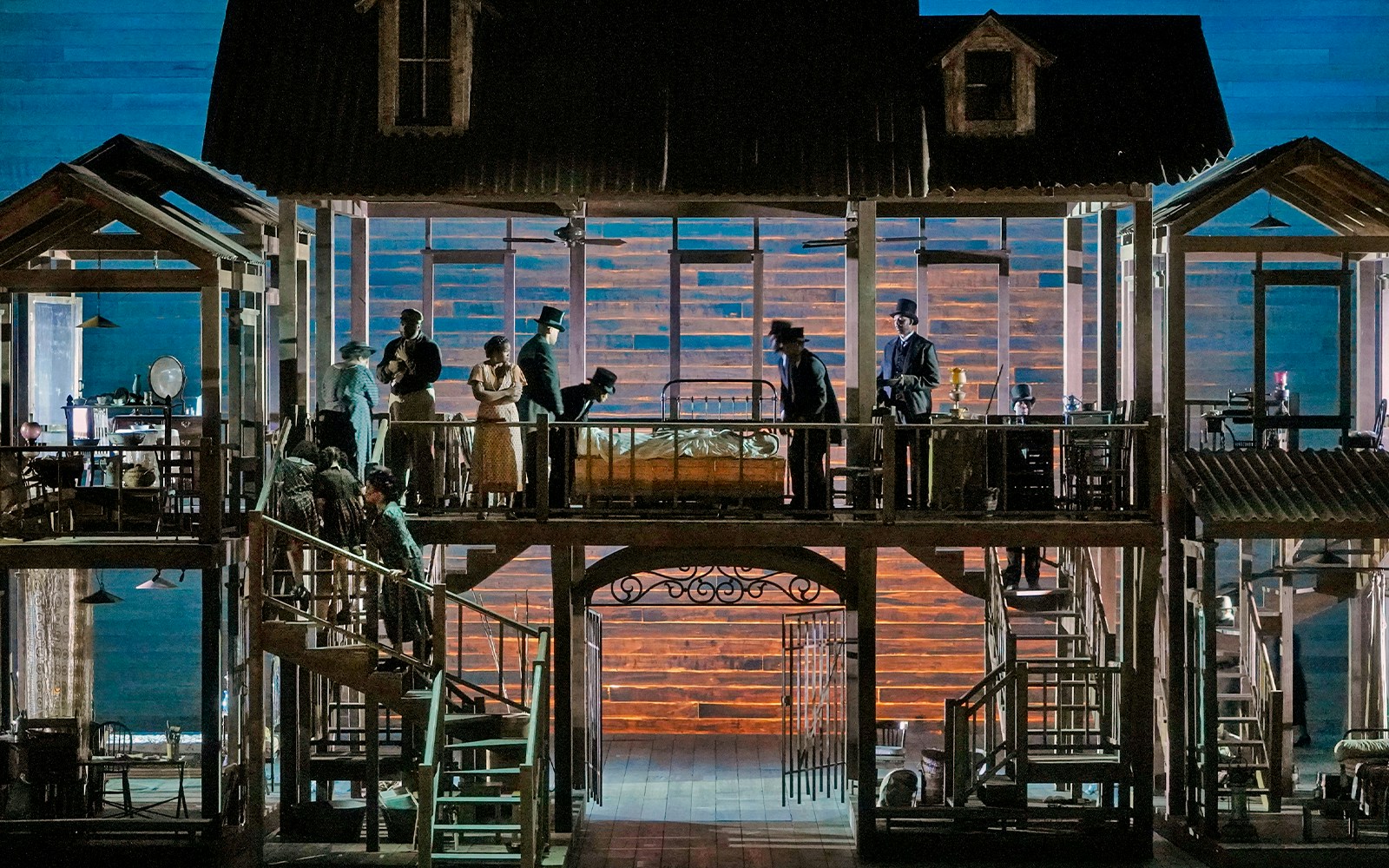 Actors performing on a multi-level stage during Porgy and Bess show.