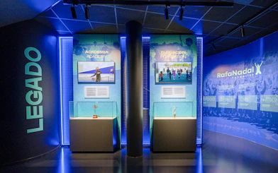 Interiors of the Rafa Nadal Museum showcasing tennis academy and foundation exhibits.