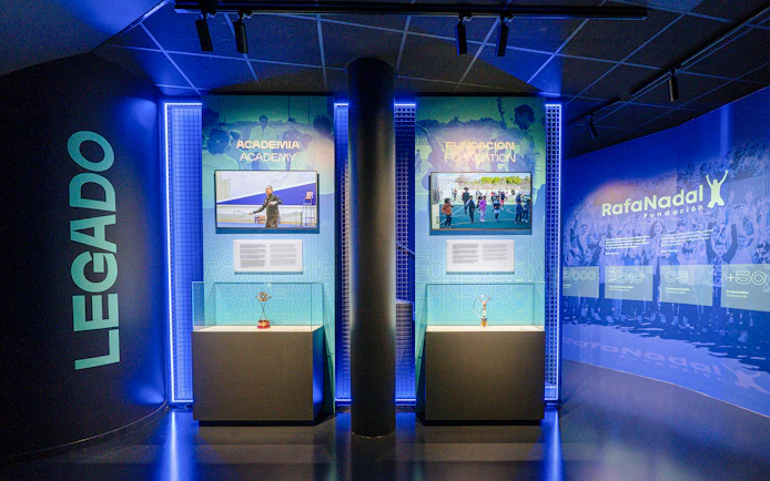 Interiors of the Rafa Nadal Museum showcasing tennis academy and foundation exhibits.