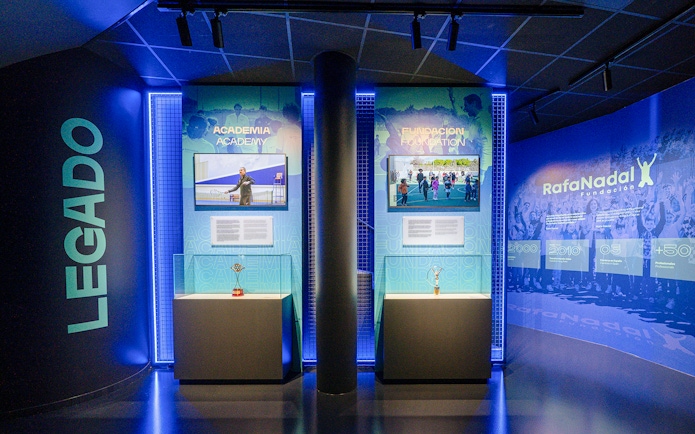 Interiors of the Rafa Nadal Museum showcasing tennis academy and foundation exhibits.