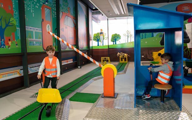 Children engaging in interactive play at The City of Children and Youth.