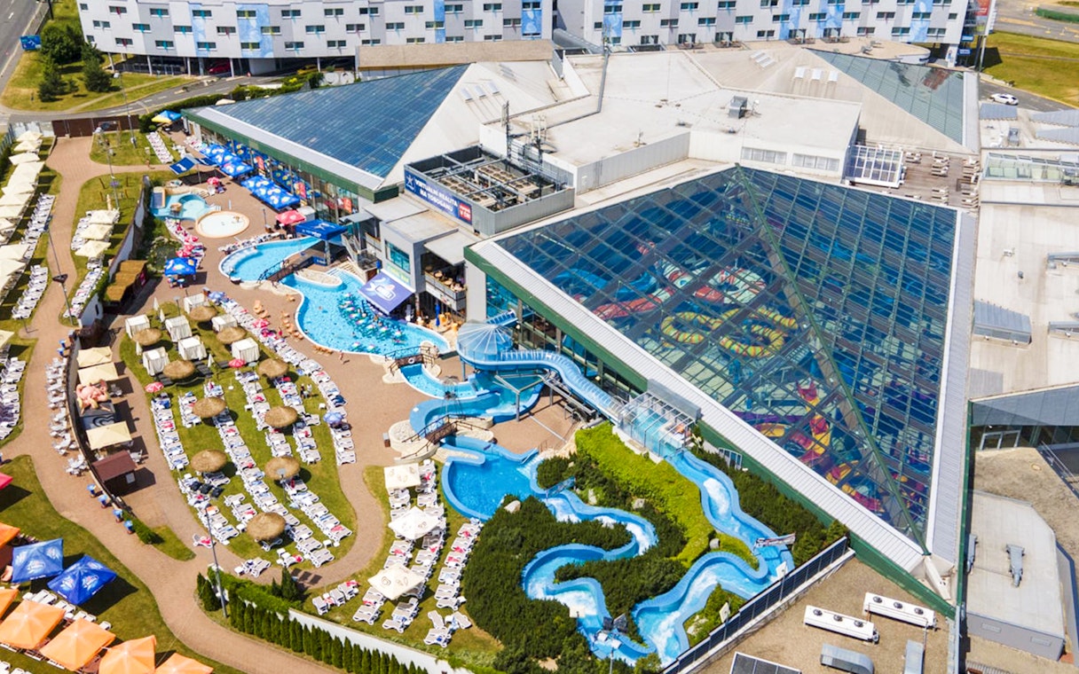Aerial view of Aquapalace Water World with pools and water slides in Prague.