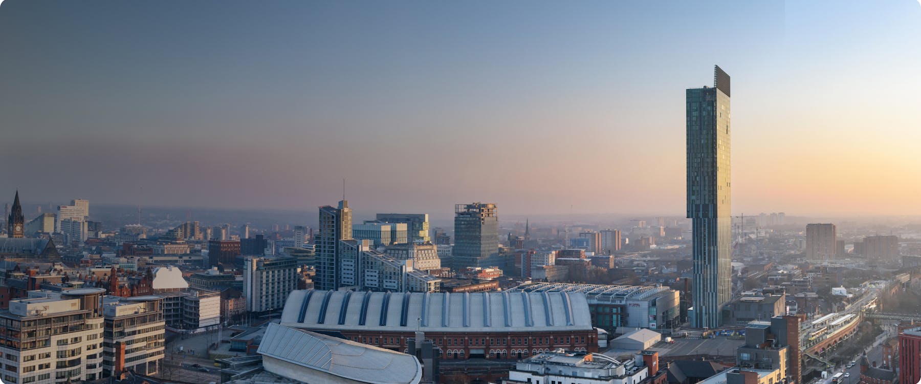 Manchester skyline with Beetham Tower at sunset.
