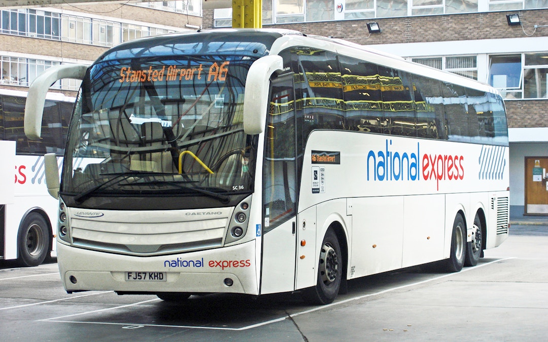 National Express coach at Luton Airport terminal.