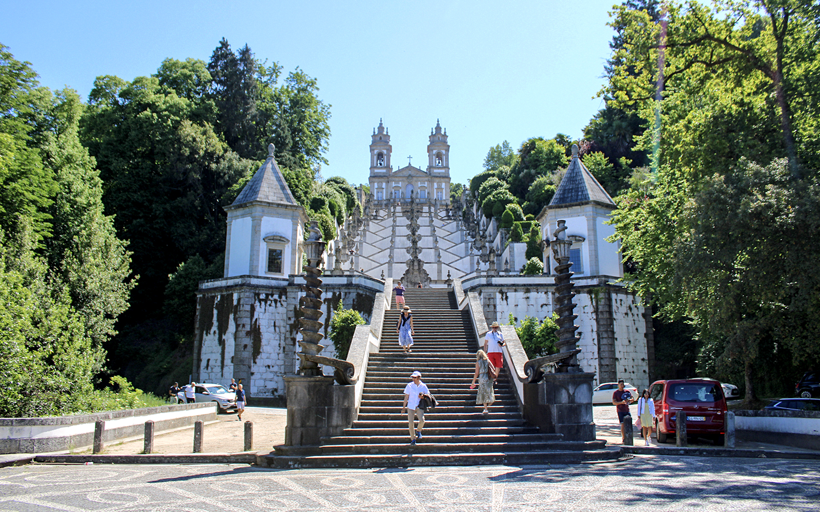 Bom Jesus do Monte staircase in Braga, Portugal, with visitors exploring the site.