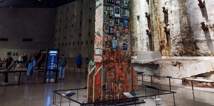 Steel column with memorial tributes in 9/11 Memorial Hall, New York City.