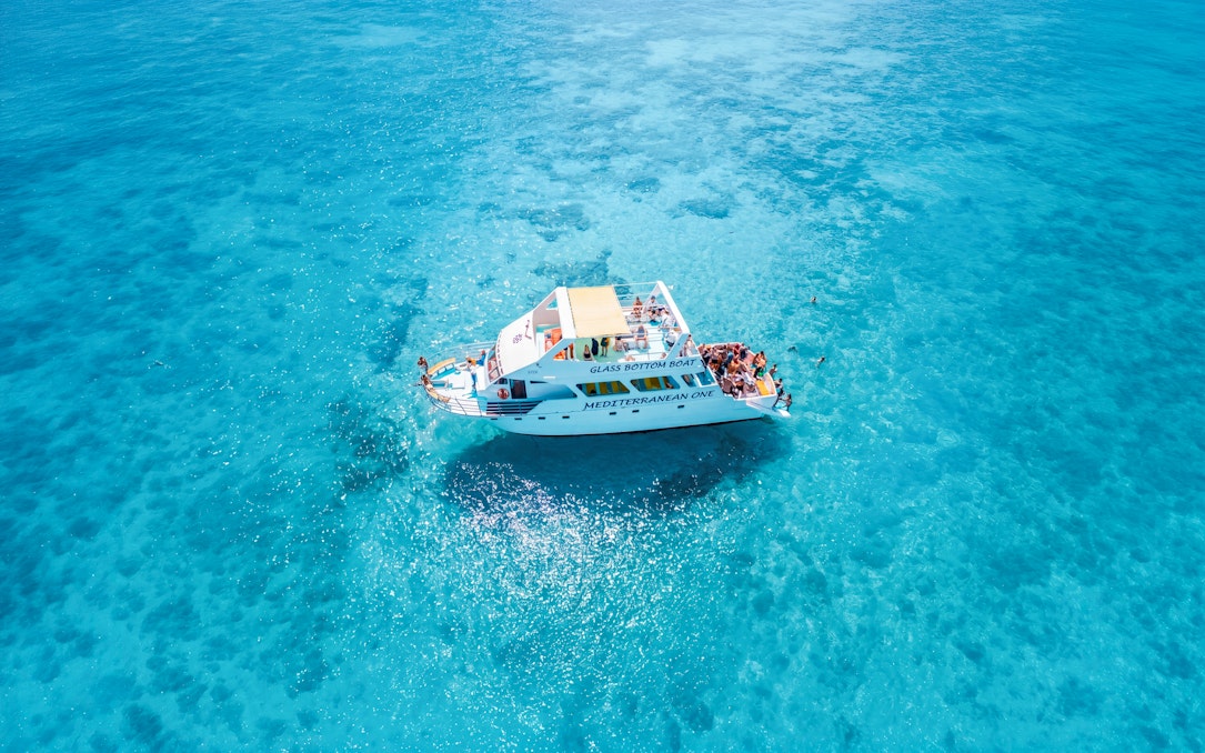 Glass-bottom boat Mediterranean One cruising in clear blue waters near Latchi.