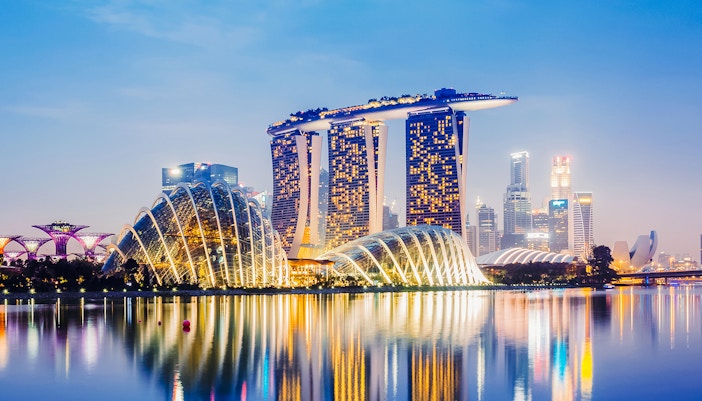 Tourists enjoying the panoramic view of Singapore cityscape from Marina Bay Sands Skypark Observation Deck