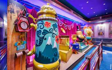 Colorful cartoon-themed decor at Mickey's Toontown attractions, Disneyland Park, California.