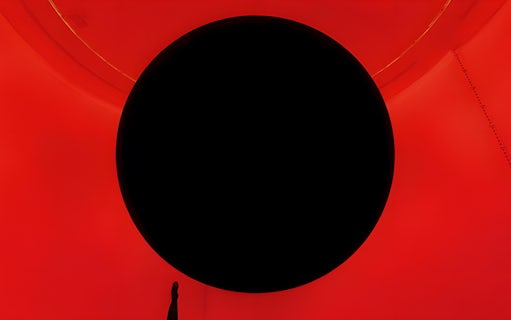 Immersive red and black art installation at TeamLab Phenomena Abu Dhabi.