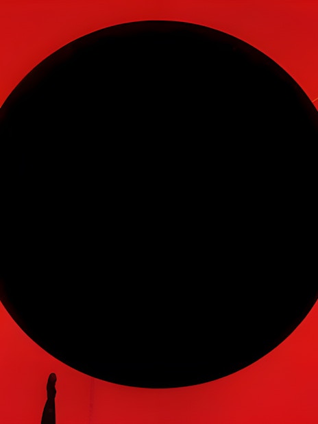 Immersive red and black art installation at TeamLab Phenomena Abu Dhabi.