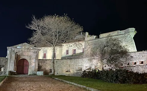 Fortress of São João Baptista at night in Porto, Portugal, part of a self-guided city exploration game.