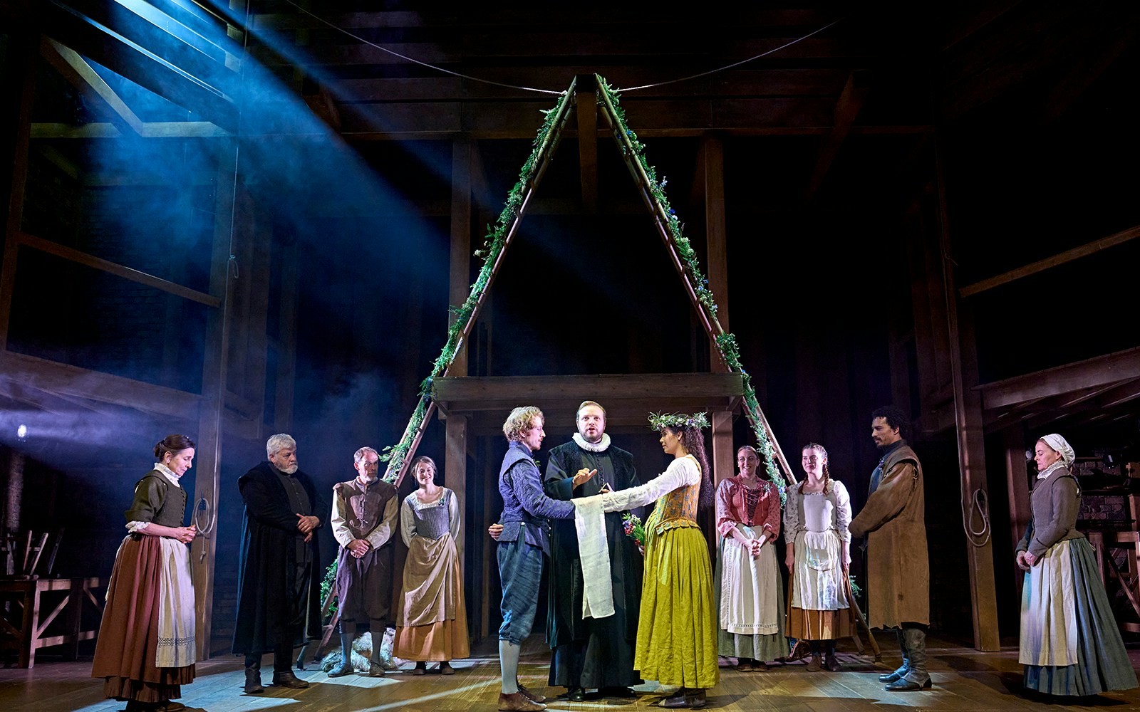 Theater performance of "Hamnet" with actors in period costumes on stage.